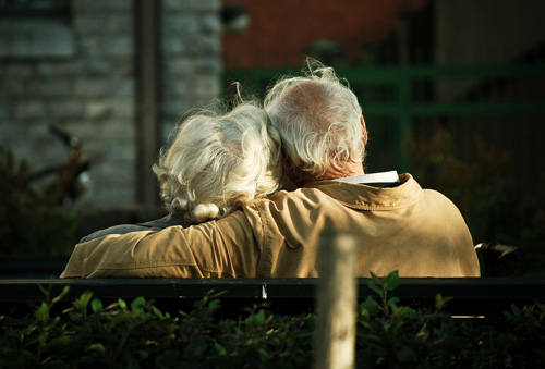 Mature couple enjoying quiet conversation, symbolizing deep connection and companionship in later life, perfect for over 50 dating and finding love after 50 on BadsX.com.
